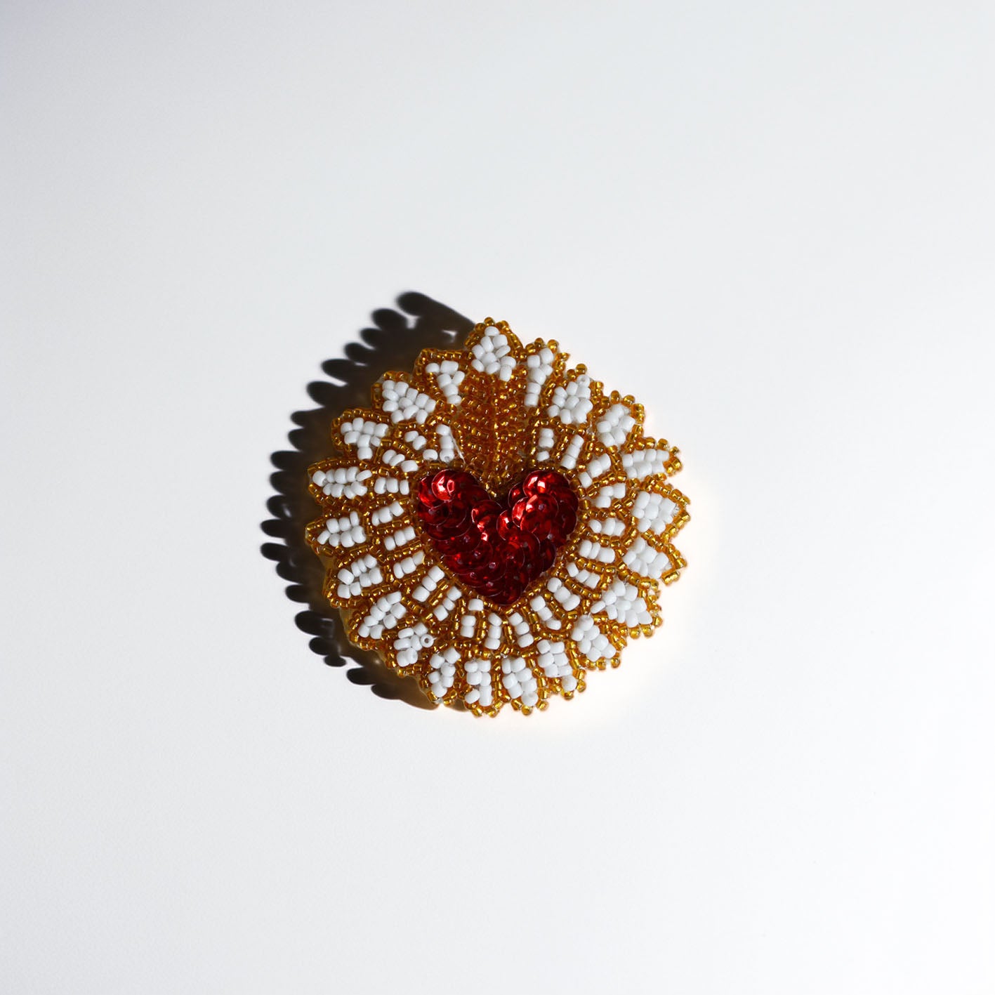 Broche Nina Rood Goud